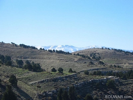 Snow On The Mountains Behind The Park In Automn