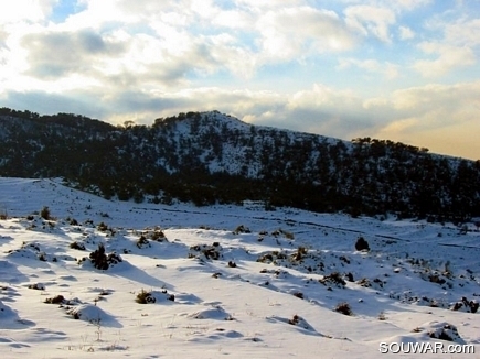 Snow & Clouds At Sunset