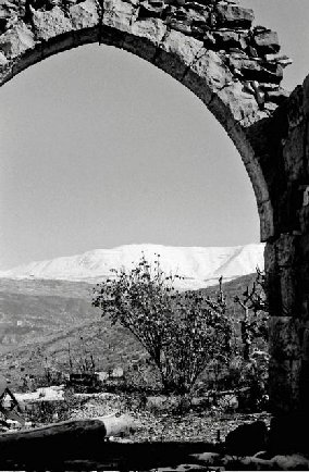 1970s. Photo taken through the remnants of the archway of an old house sannine