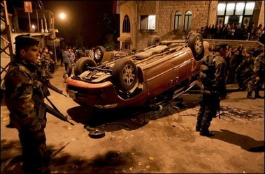 After supporters of assassinated Lebanese Industry Minister Pierre Gemayel destroyed cars belonging to supporters of the Syrian Nationalist Social Party