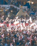 Tens of thousands of protesters gather in Beiruts Martyrs Square.